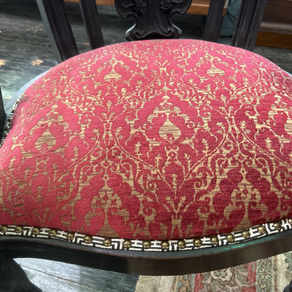 German Dark Wood Carved Chair, Red Pattern Upholstery.