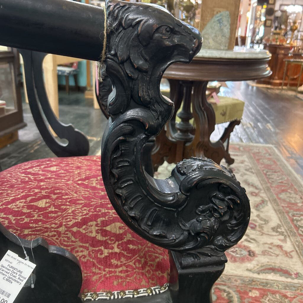 German Dark Wood Carved Chair, Red Pattern Upholstery.