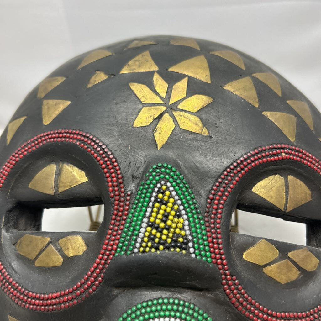 Carved wood ceremonial beaded with brass inlays tribal mask, made in Ghana.