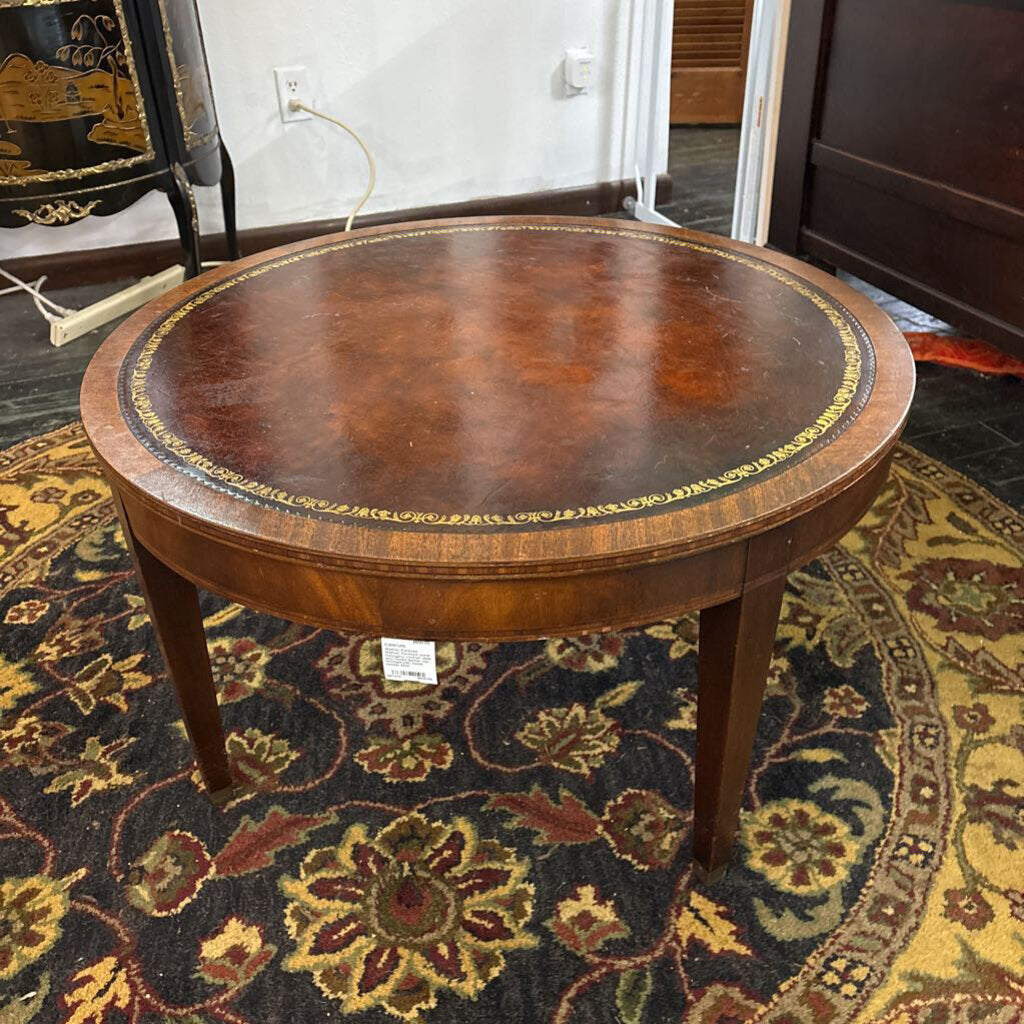 Weiman Furniture round mahogany cocktail table with tooled leather top ; circa 1930-50; model number 9320
