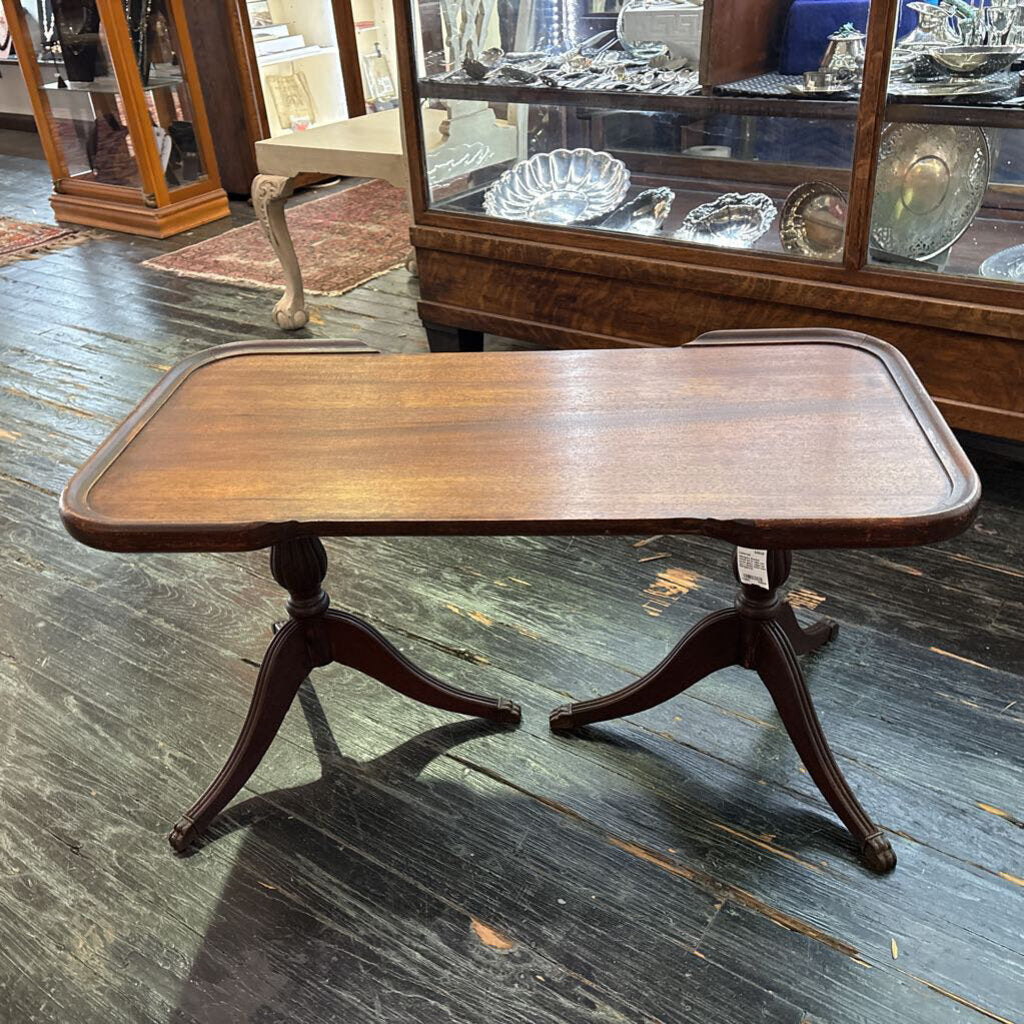 Mahogany Sheridan revival coffee table with partial gallery edged top and a double tripod base; circa 1930-50