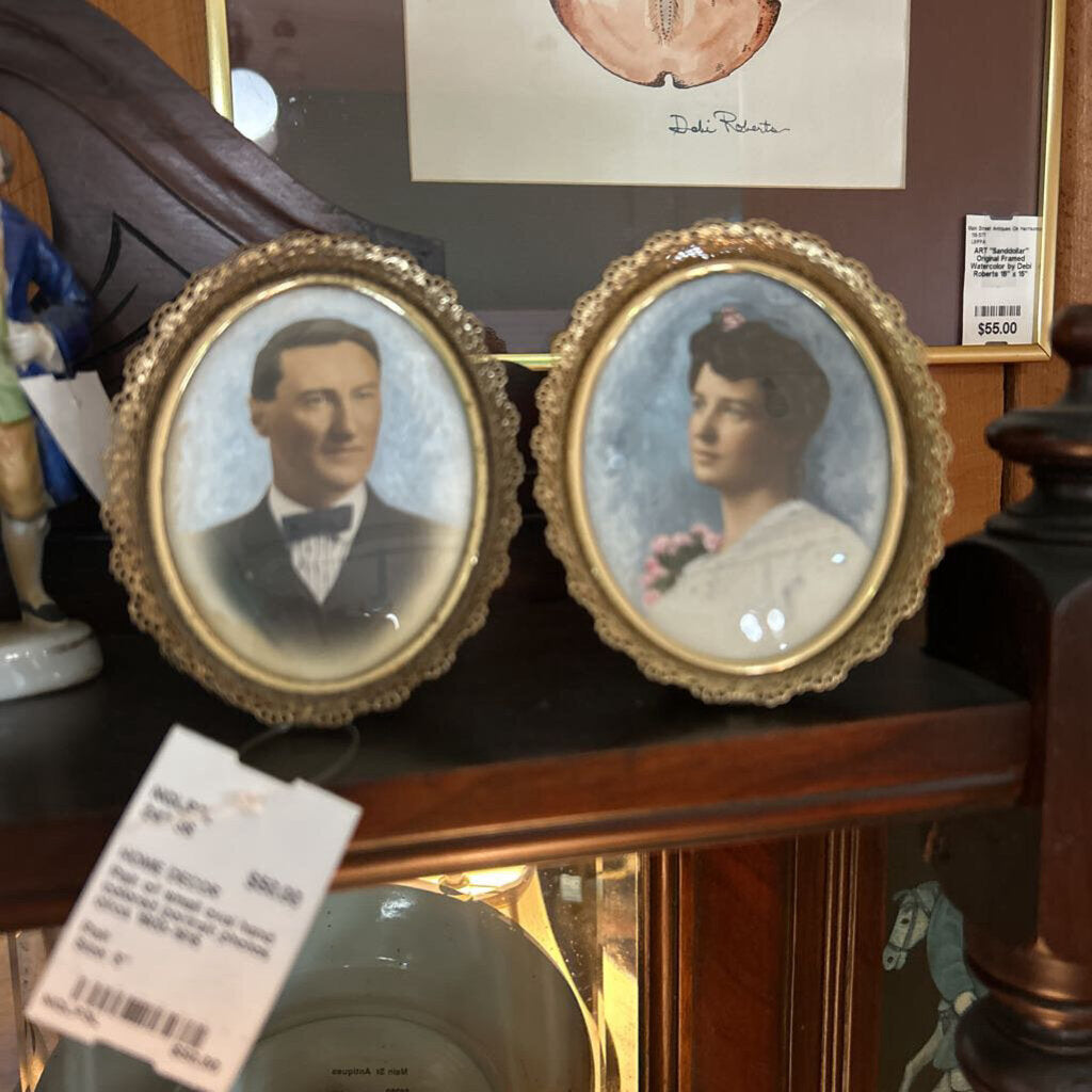 Pair of small oval hand colored portrait photos circa 1900-1915