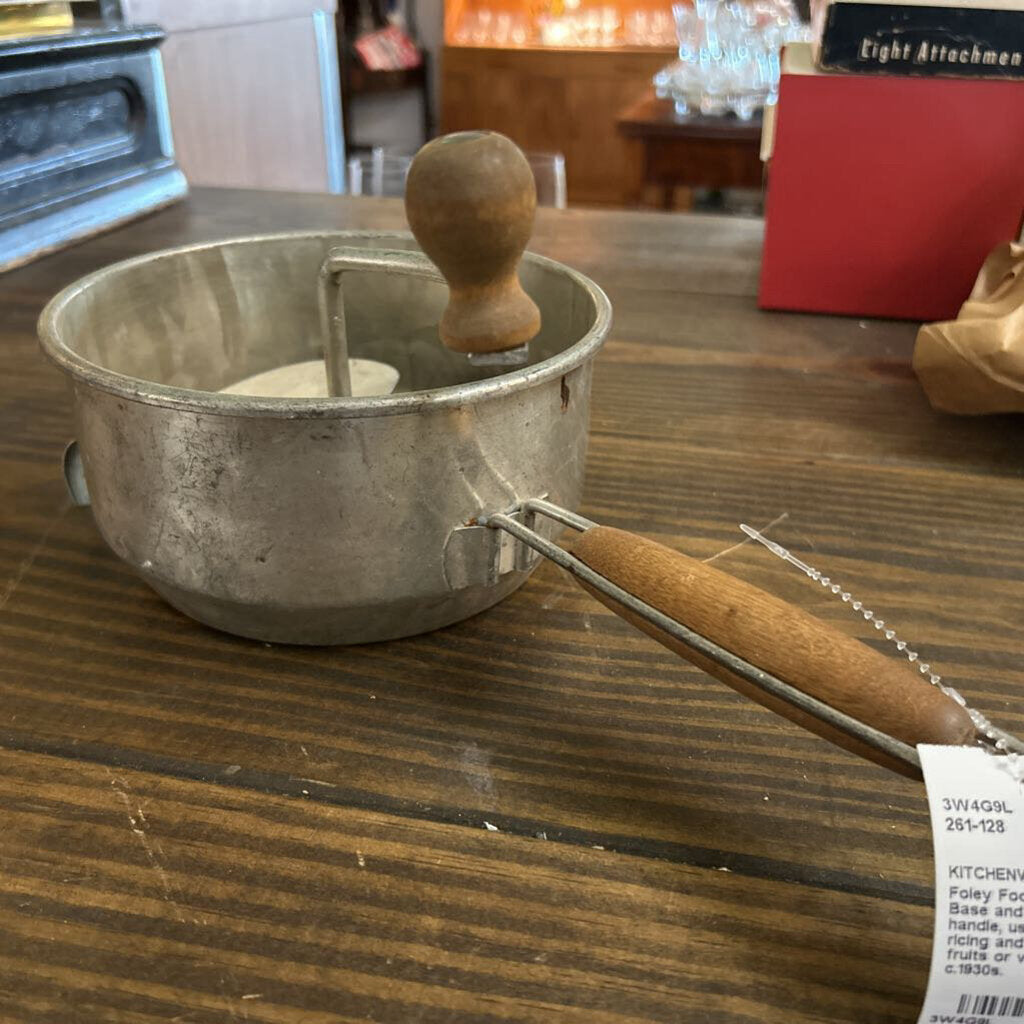 Foley Food Mill, Strainer Base and wooden handle, used for pureeing, ricing and straining fruits or vegetable. c.1930s.