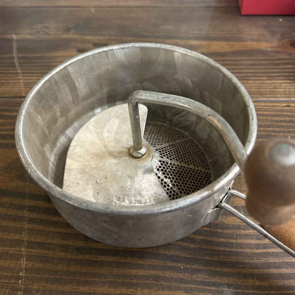 Foley Food Mill, Strainer Base and wooden handle, used for pureeing, ricing and straining fruits or vegetable. c.1930s.