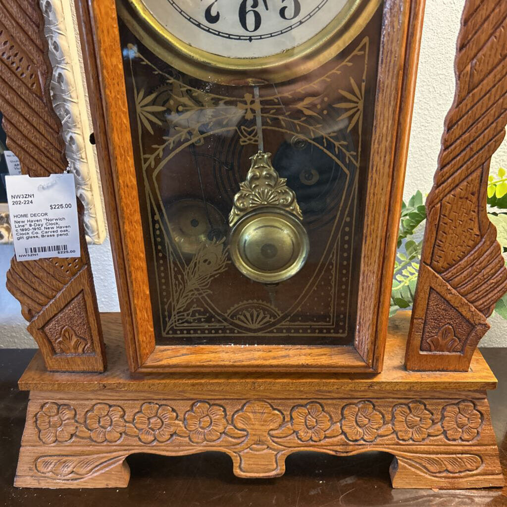 New Haven "Norwich Line" 8-Day Clock, c.1890-1910. New Haven Clock Co. Carved oak, gilt glass, Brass pend.