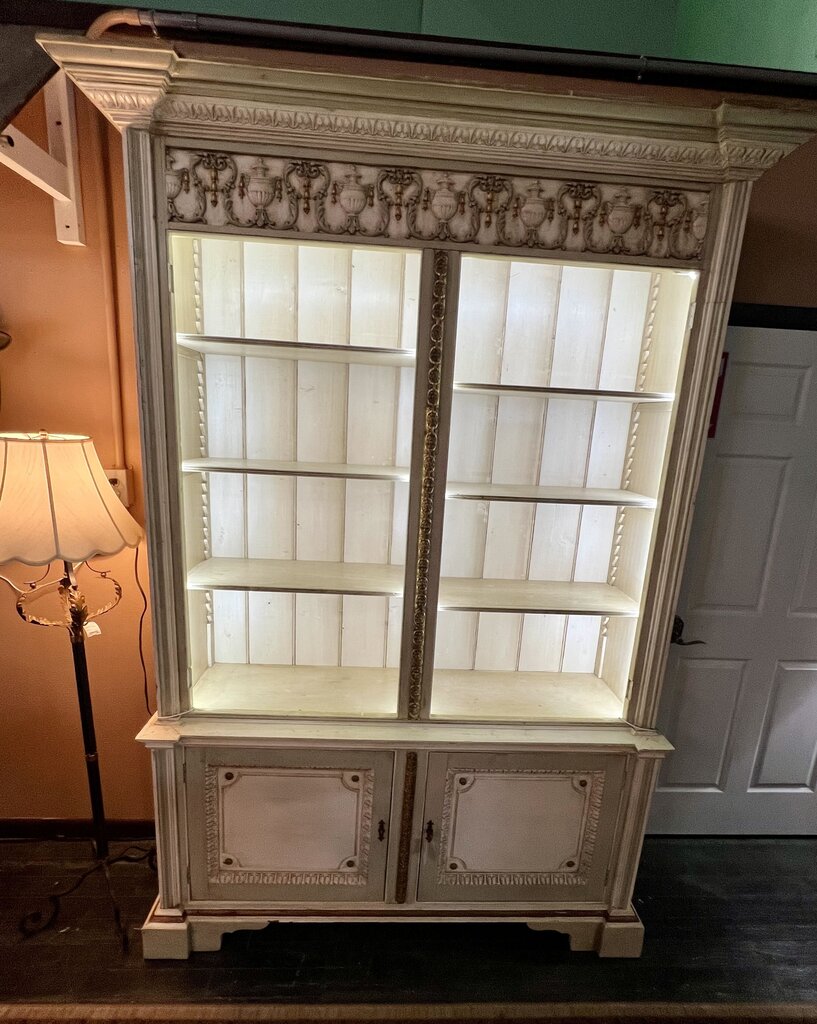 19th Century French Neoclassical Display Hutch in the Louis XVI style. Painted and Gilt surfaces with six adjustable shelves above and one fixed shelf below.