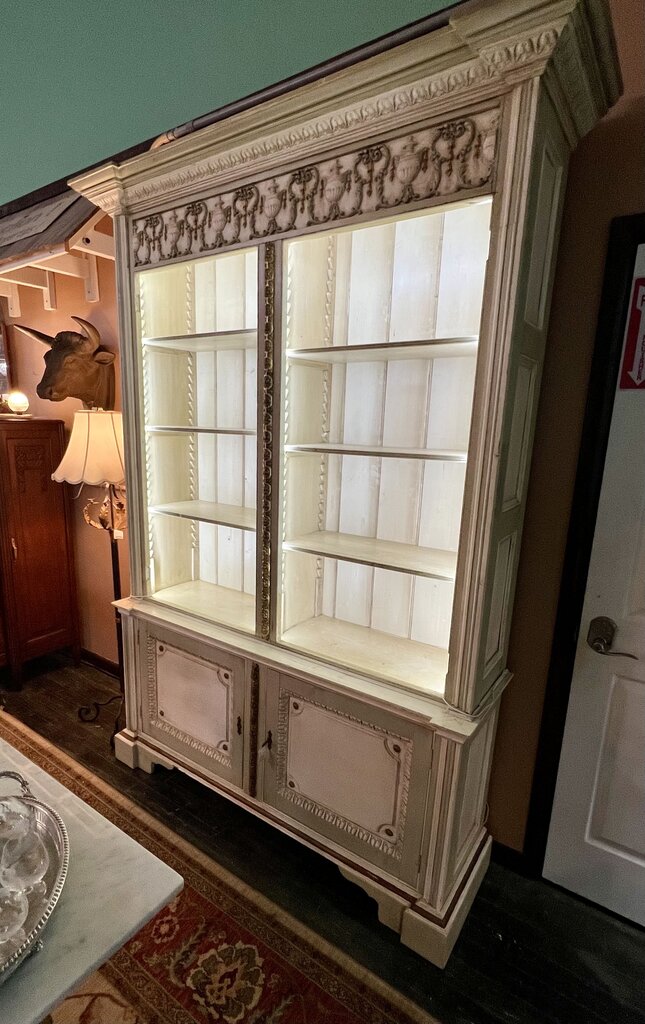 19th Century French Neoclassical Display Hutch in the Louis XVI style. Painted and Gilt surfaces with six adjustable shelves above and one fixed shelf below.