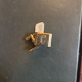 Gold tone rectangle block cufflinks engraved with "C"