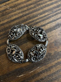 White Metal Bracelet w/ Sculptural Floral Roundels