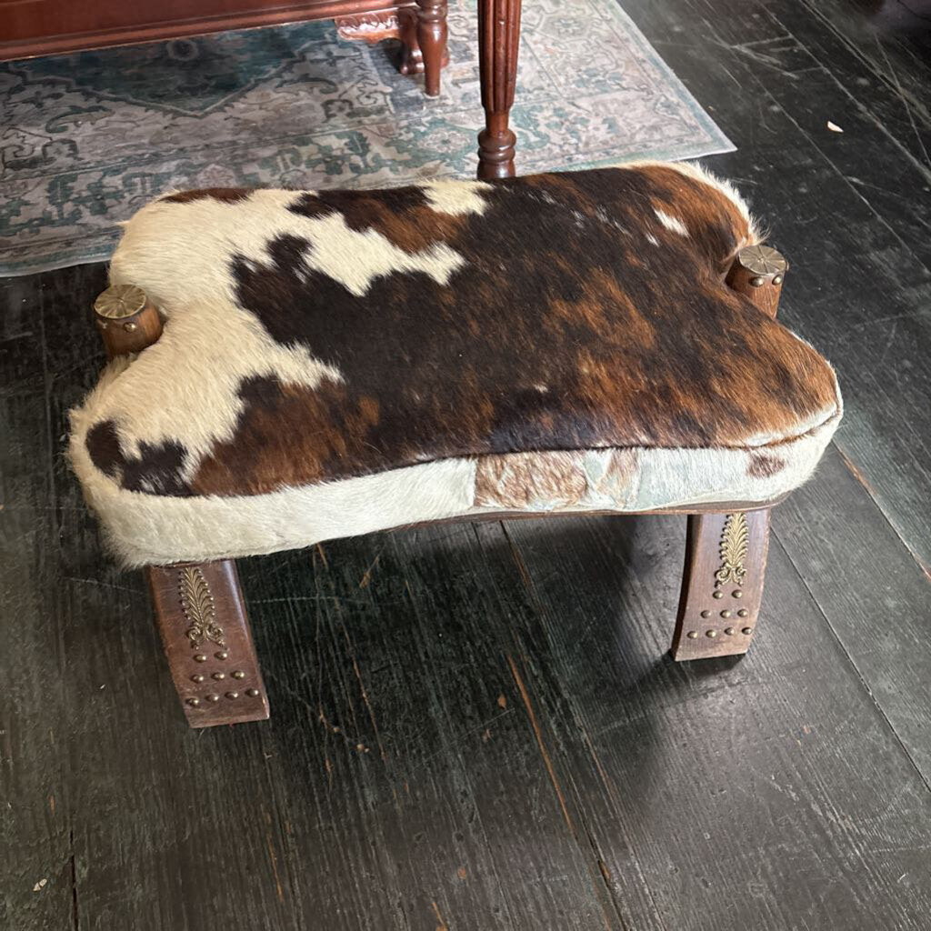 Cowhide Camel Saddle Footstool with brass trim; circa 1950-70