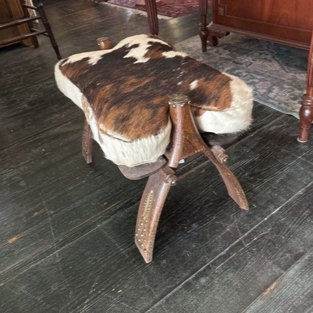 Cowhide Camel Saddle Footstool with brass trim; circa 1950-70