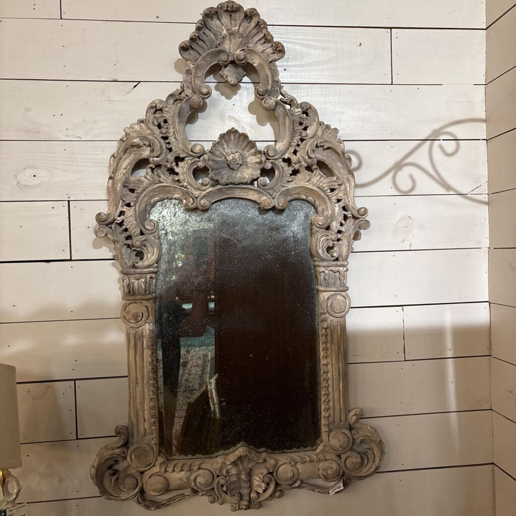 Solid wood, hand carved Rococo revival mirror with a whitewashed finish. Circa 1960-80.