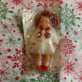ARI German Rubber Dollhouse Doll 1960/70s. Original molded red bonnet, red shoes, fuzzy white faux-fur coat.