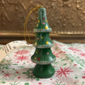 Miniature hand-painted wooden Christmas tree ornament.