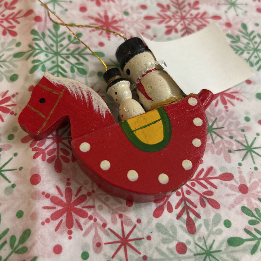 Vintage Hand-painted wooden snowman on a rocking horse.