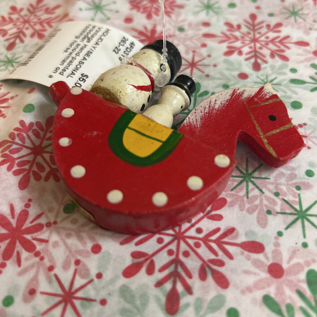 Vintage Hand-painted wooden snowman on a rocking horse.