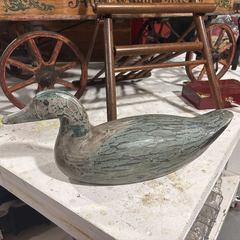 Carved wooden distressed duck decoy