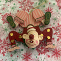Wooden hand-painted contortionist Christmas ornament.