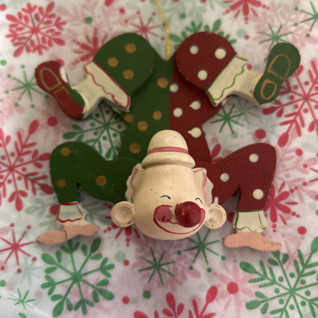 Wooden hand-painted contortionist Christmas ornament.