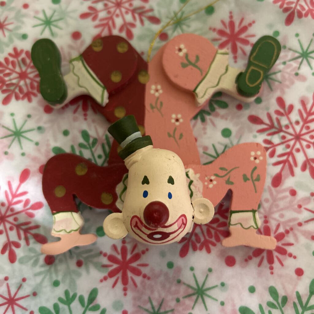 Wooden hand-painted contortionist Christmas ornament.