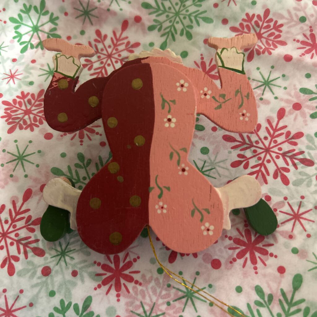 Wooden hand-painted contortionist Christmas ornament.