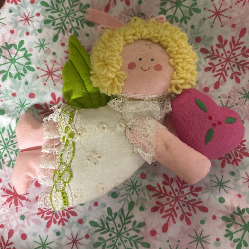 Vintage fabric angel ornament, holding heart.
