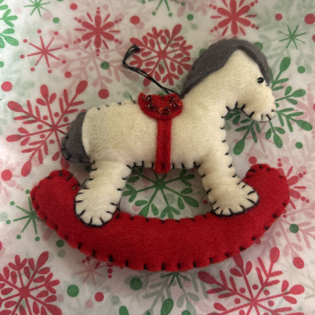 Felt Christmas rocking horse ornament.