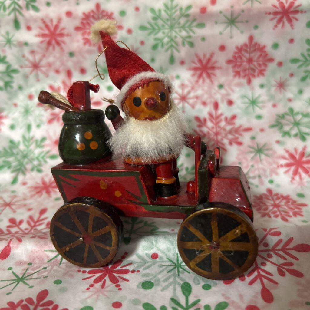 Vintage wooden Santa driving car ornament c.1970s.