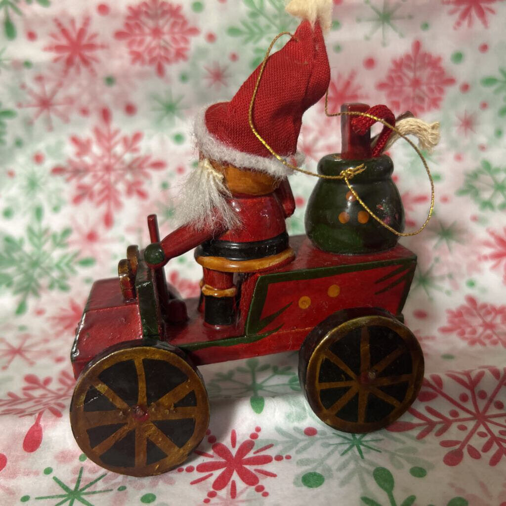 Vintage wooden Santa driving car ornament c.1970s.