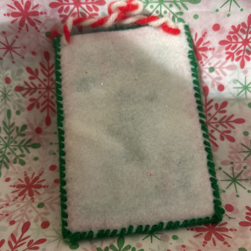 Handmade needlepoint "noel" Christmas ornament.