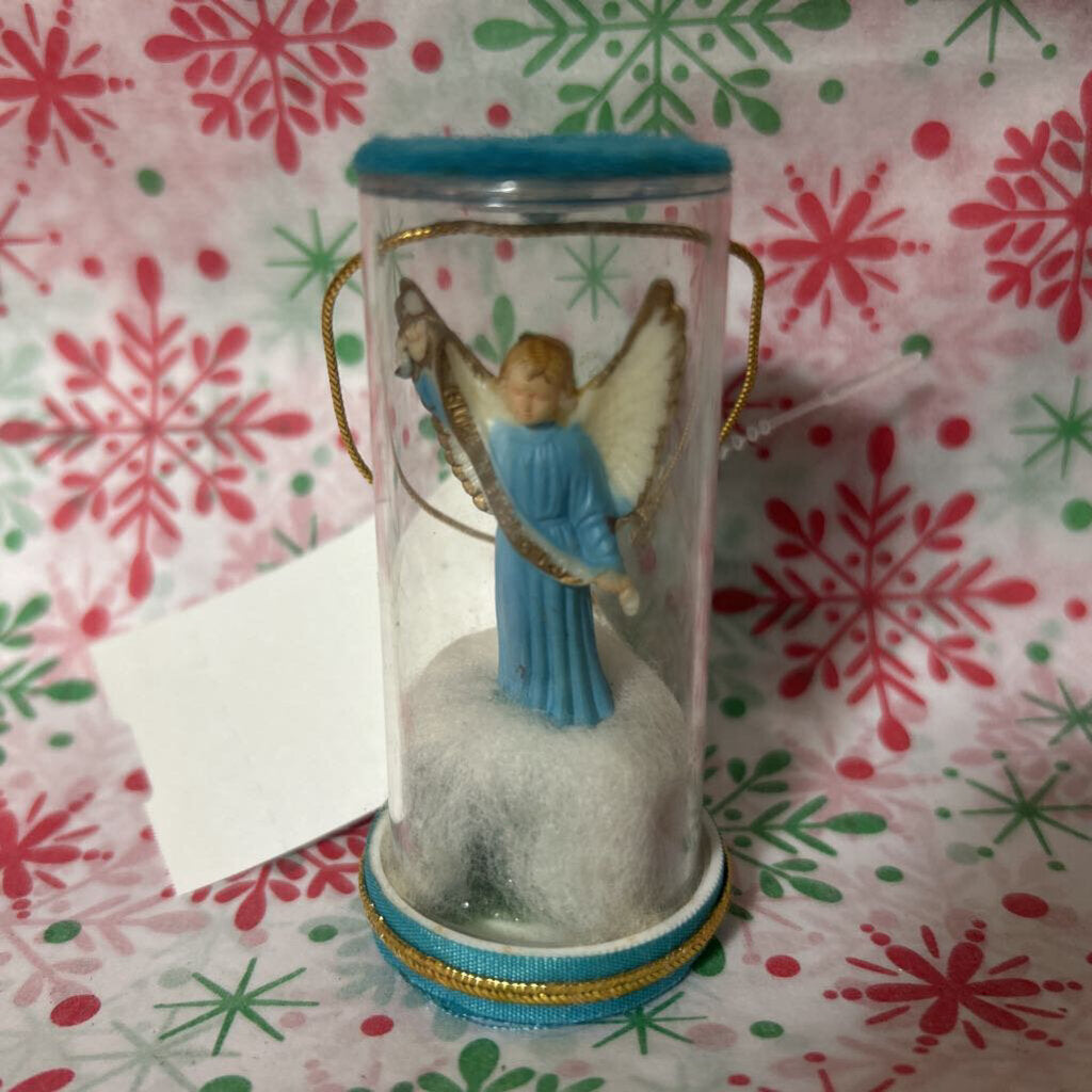 Baby angel inside clear cylindrical jar ornament, Christmas.
