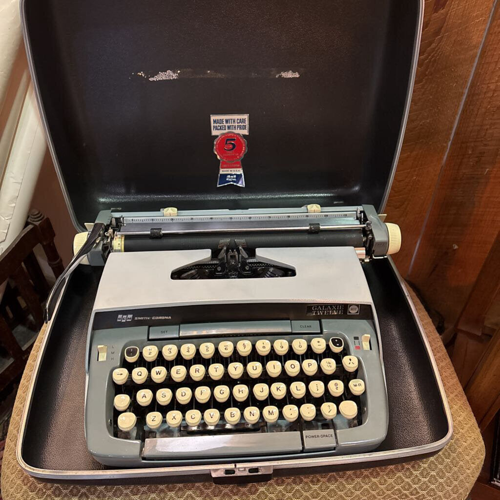 Smith Corona Galaxie Twelve portable manual typewriter w/ hard-shell carrying case; circa 1960s. Mint condition
